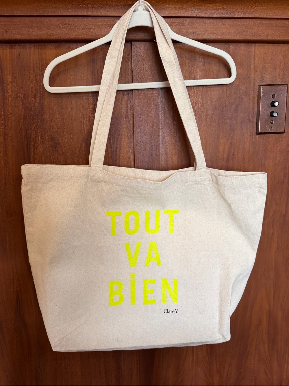 Clare V Canvas Large Tote with Neon Yellow ‘Tout Va Bien’ on beige tote